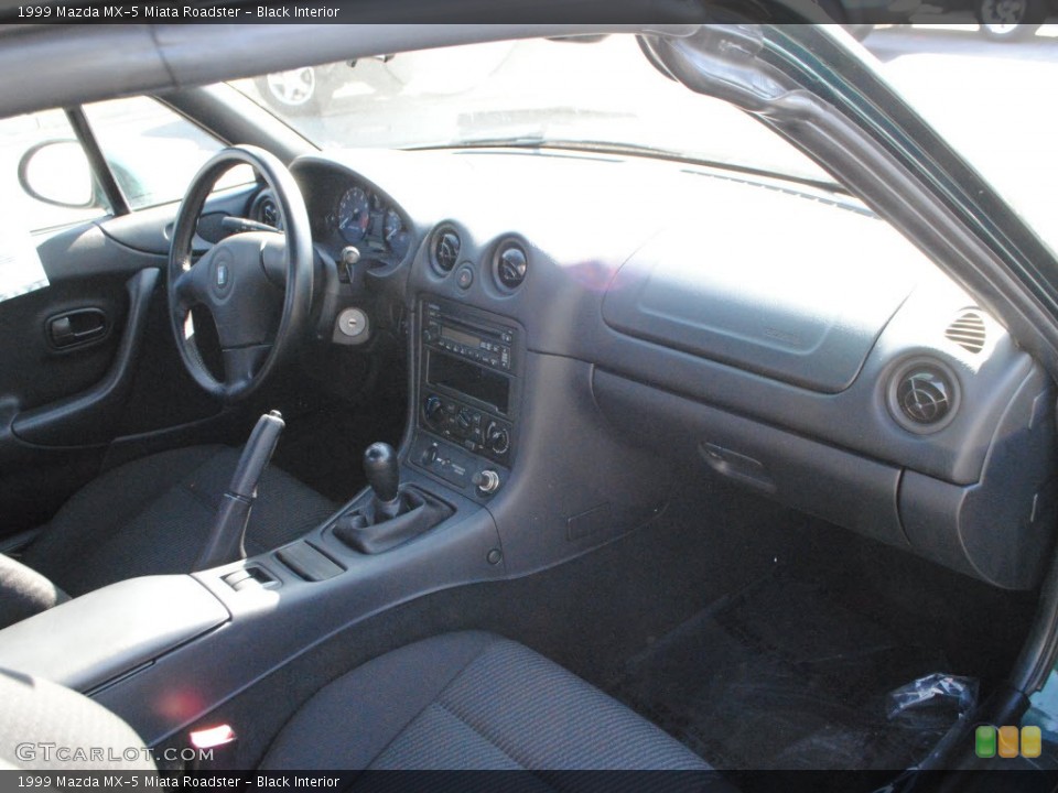 Black Interior Dashboard for the 1999 Mazda MX-5 Miata Roadster #56737157