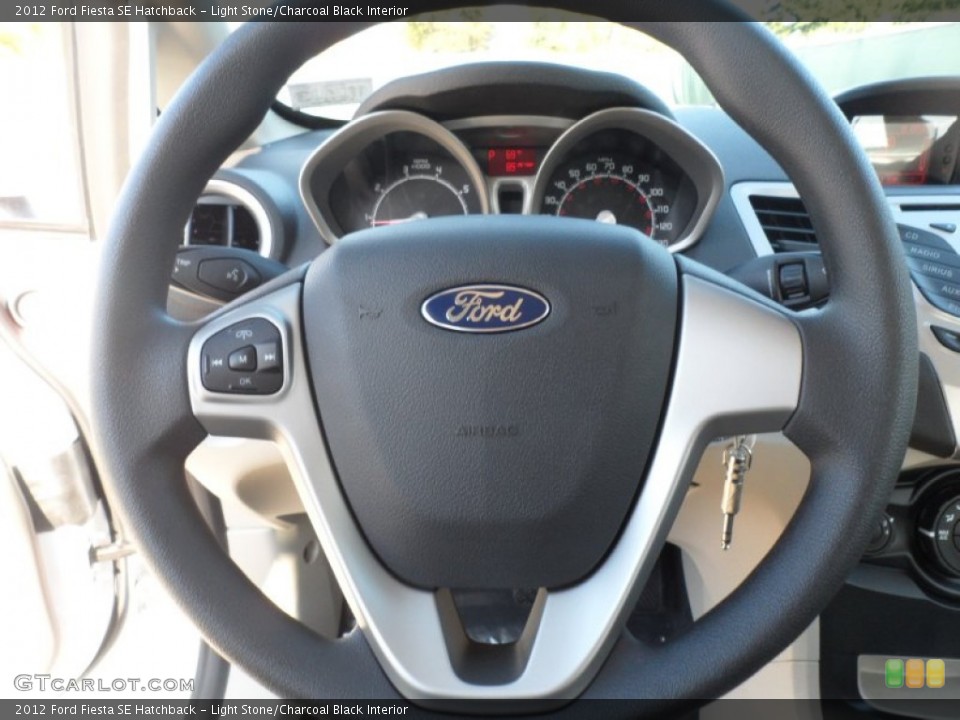 Light Stone/Charcoal Black Interior Steering Wheel for the 2012 Ford Fiesta SE Hatchback #56745147