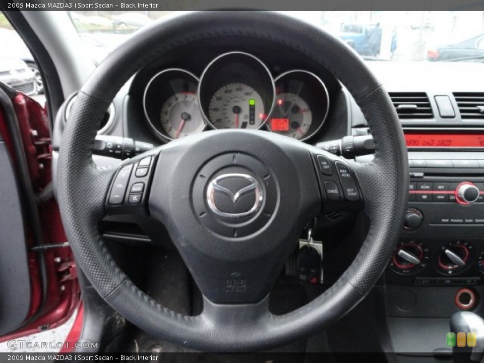 Black Interior Steering Wheel for the 2009 Mazda MAZDA3 i Sport Sedan #56842663