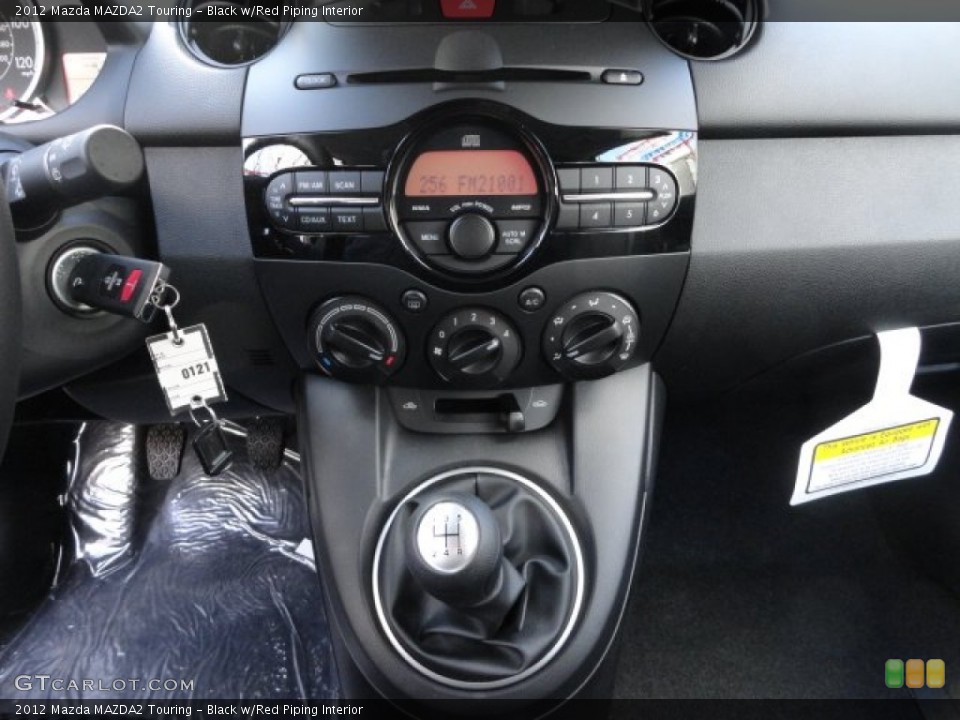 Black w/Red Piping Interior Controls for the 2012 Mazda MAZDA2 Touring #56928454