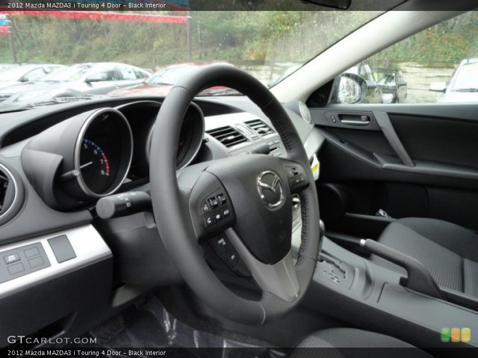 Black Interior Steering Wheel for the 2012 Mazda MAZDA3 i Touring 4 Door #57018347