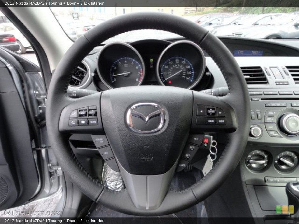 Black Interior Steering Wheel for the 2012 Mazda MAZDA3 i Touring 4 Door #57018362