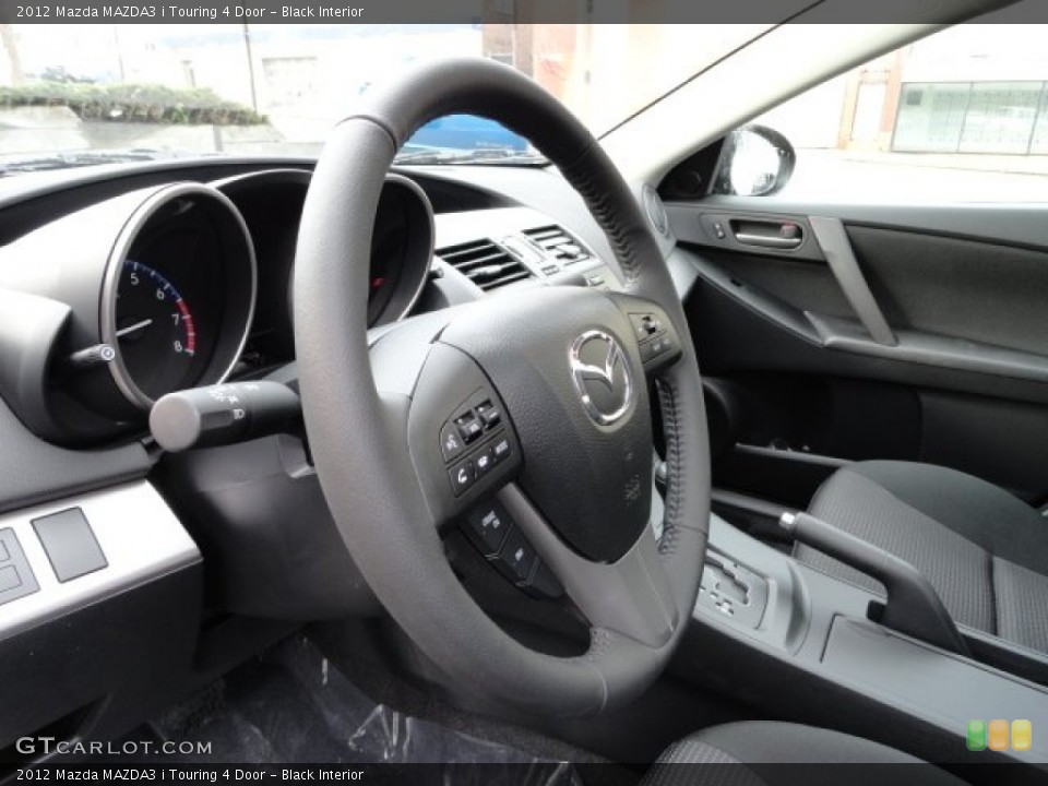 Black Interior Steering Wheel for the 2012 Mazda MAZDA3 i Touring 4 Door #57018524