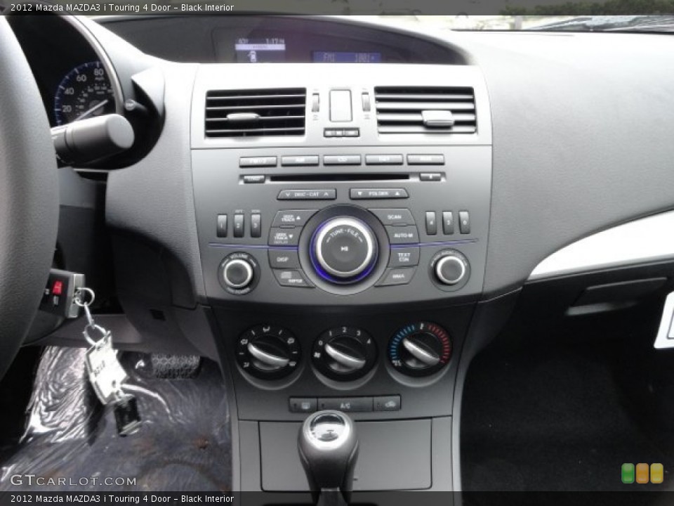 Black Interior Controls for the 2012 Mazda MAZDA3 i Touring 4 Door #57018550