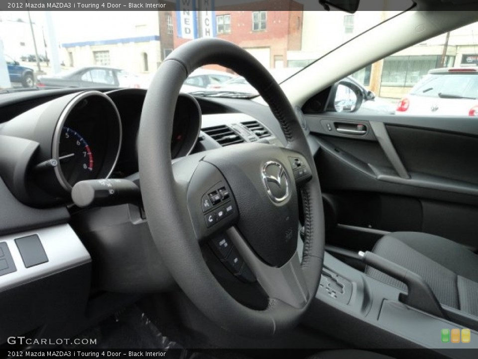 Black Interior Steering Wheel for the 2012 Mazda MAZDA3 i Touring 4 Door #57018710