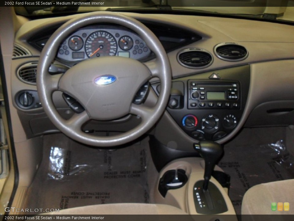 Medium Parchment Interior Dashboard for the 2002 Ford Focus SE Sedan #57085553