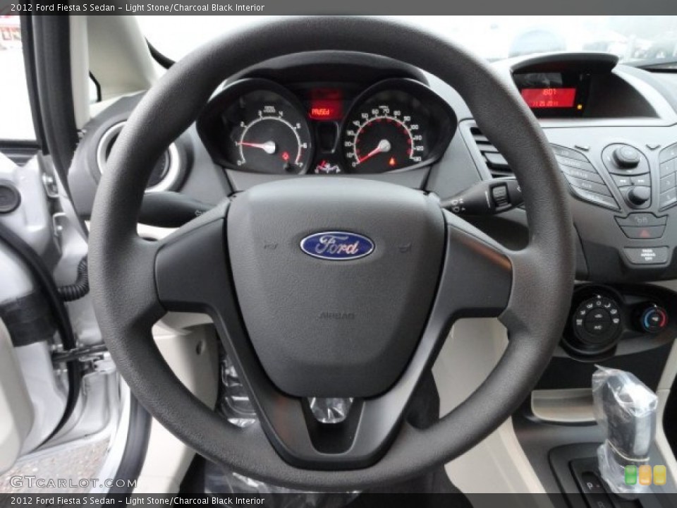 Light Stone/Charcoal Black Interior Steering Wheel for the 2012 Ford Fiesta S Sedan #57144586