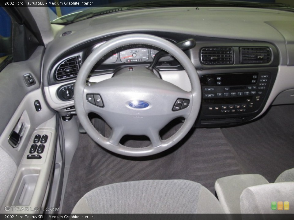 Medium Graphite Interior Dashboard for the 2002 Ford Taurus SEL #57150697