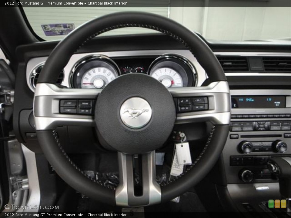 Charcoal Black Interior Steering Wheel for the 2012 Ford Mustang GT Premium Convertible #57365160
