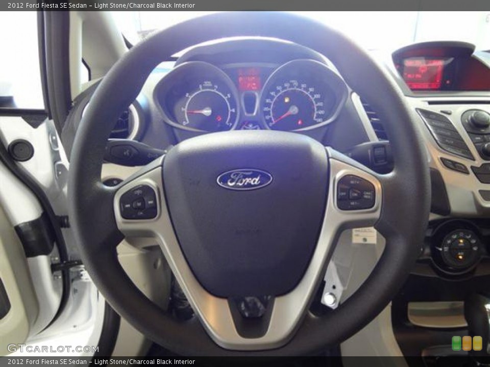 Light Stone/Charcoal Black Interior Steering Wheel for the 2012 Ford Fiesta SE Sedan #57402671