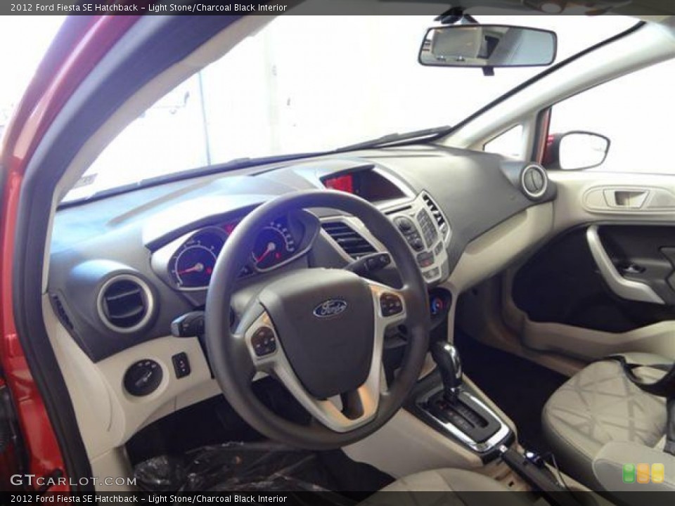 Light Stone/Charcoal Black Interior Prime Interior for the 2012 Ford Fiesta SE Hatchback #57403040