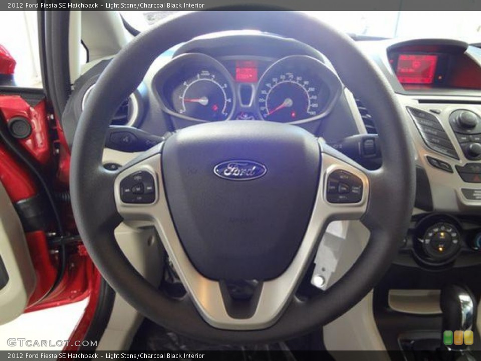 Light Stone/Charcoal Black Interior Steering Wheel for the 2012 Ford Fiesta SE Hatchback #57403106