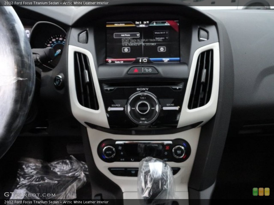 Arctic White Leather Interior Controls for the 2012 Ford Focus Titanium Sedan #57500929