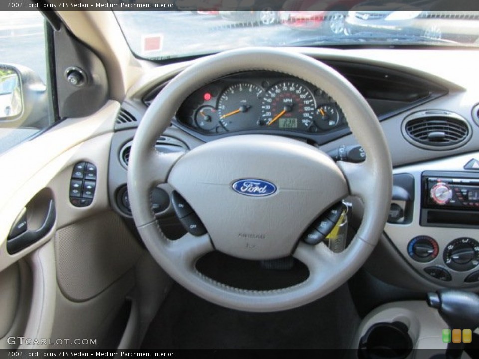 Medium Parchment Interior Steering Wheel for the 2002 Ford Focus ZTS Sedan #57611425