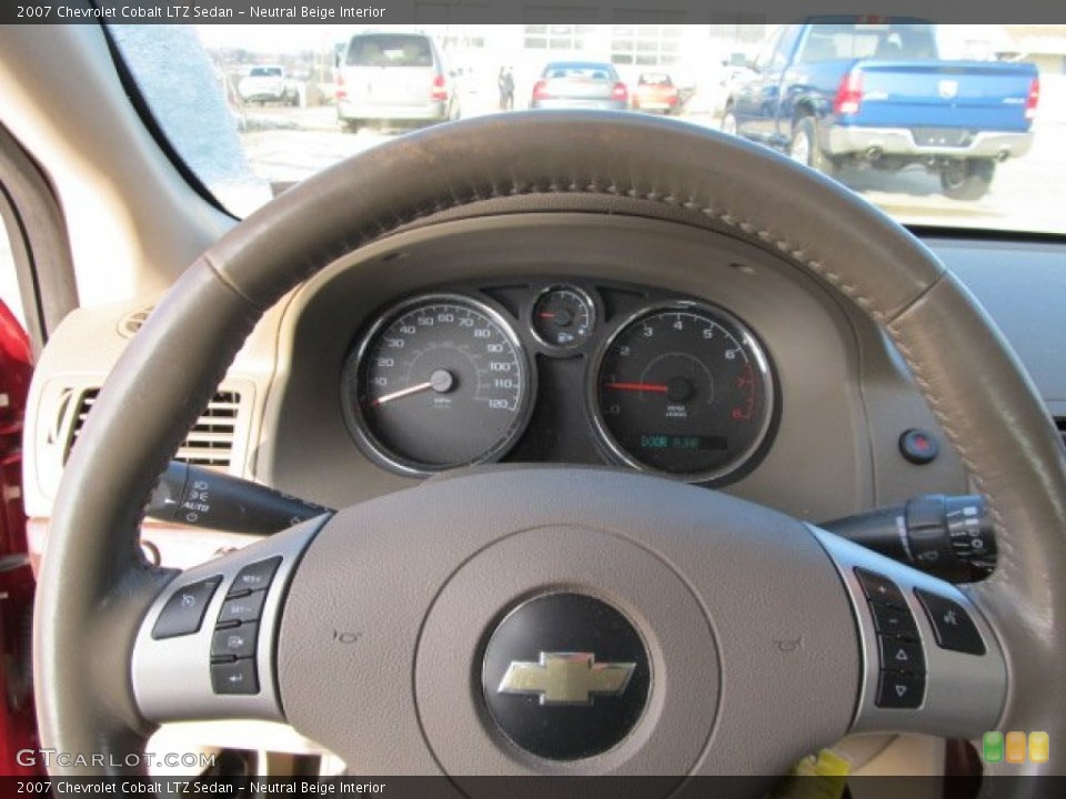Neutral Beige Interior Steering Wheel for the 2007 Chevrolet Cobalt LTZ Sedan #57657256