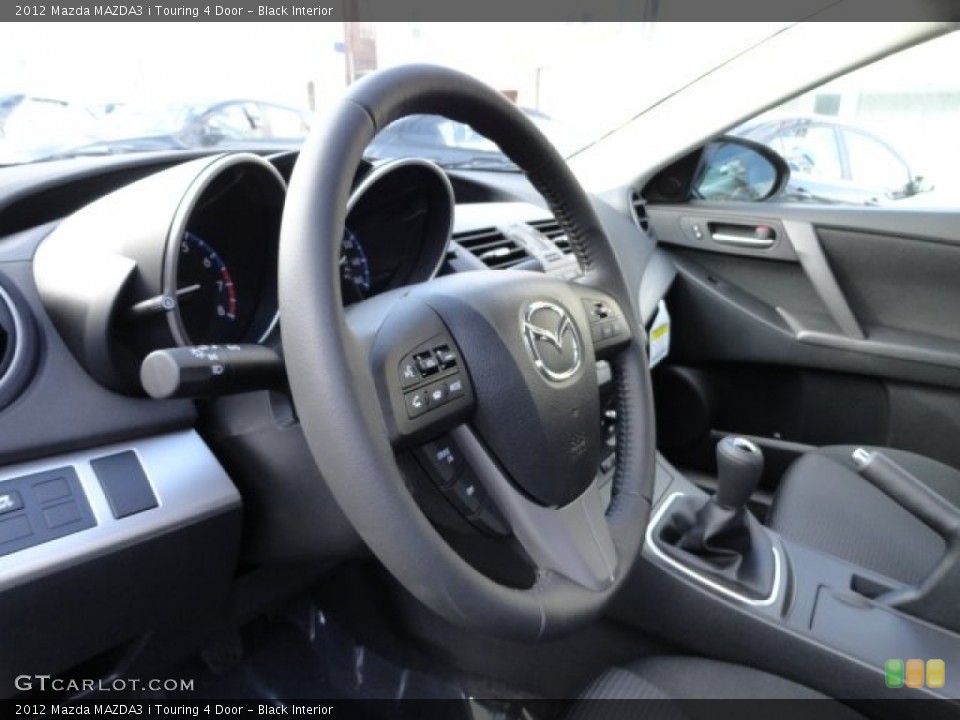 Black Interior Steering Wheel for the 2012 Mazda MAZDA3 i Touring 4 Door #57757532