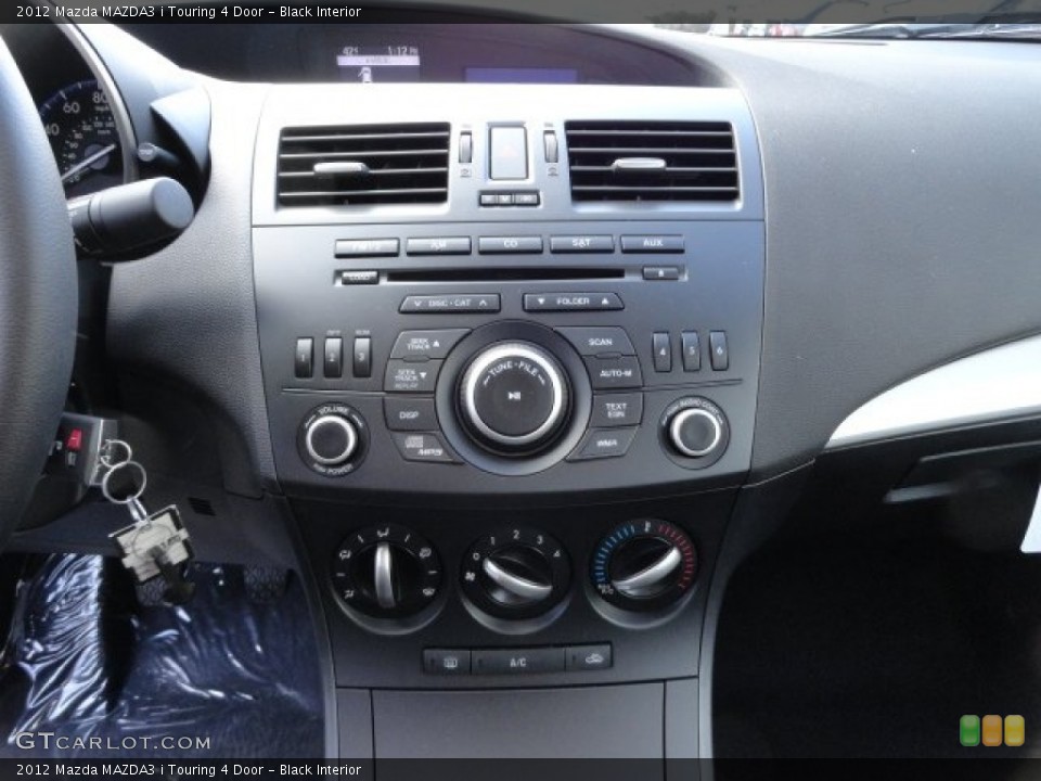 Black Interior Controls for the 2012 Mazda MAZDA3 i Touring 4 Door #57757553