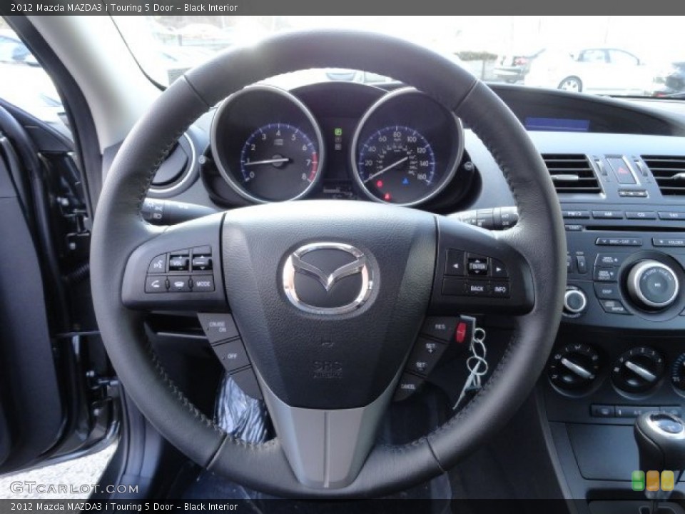 Black Interior Steering Wheel for the 2012 Mazda MAZDA3 i Touring 5 Door #57758108
