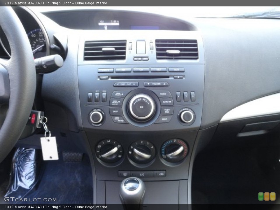 Dune Beige Interior Controls for the 2012 Mazda MAZDA3 i Touring 5 Door #57758297