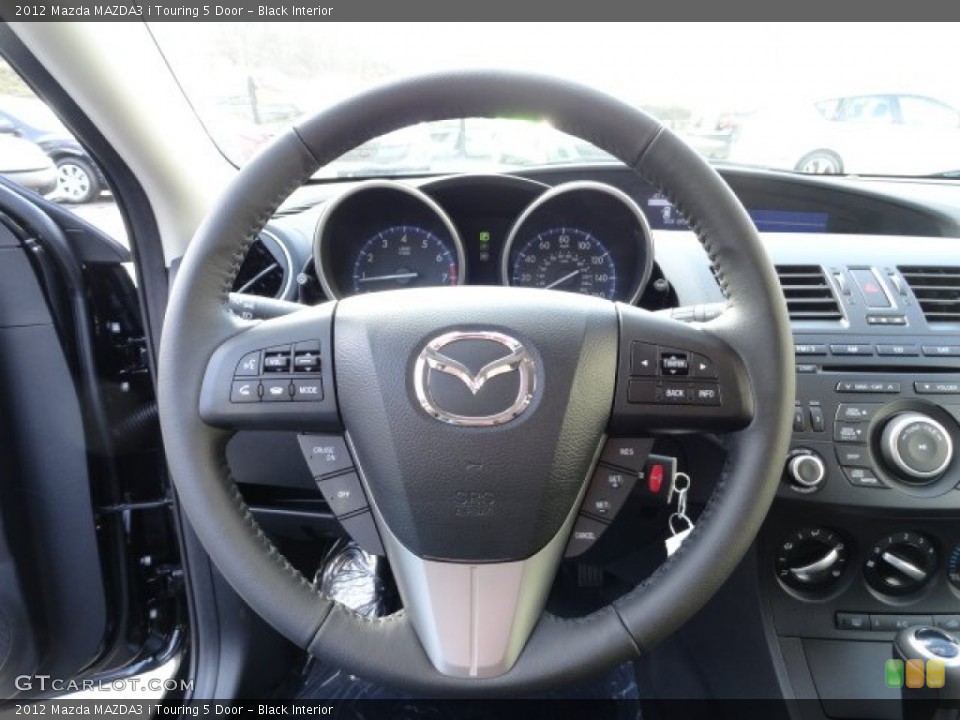 Black Interior Steering Wheel for the 2012 Mazda MAZDA3 i Touring 5 Door #57758465