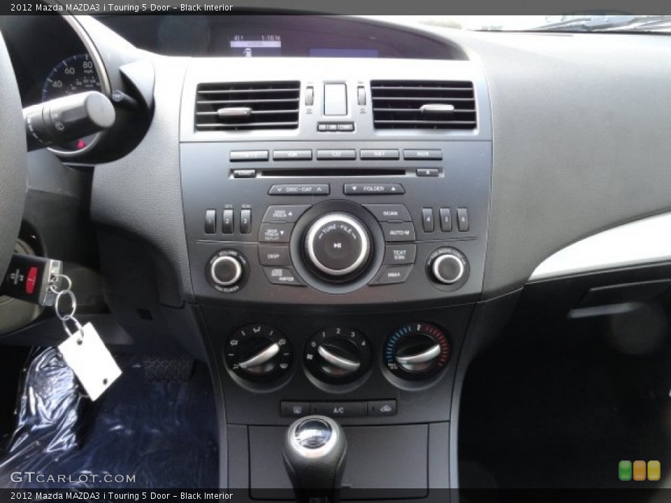 Black Interior Controls for the 2012 Mazda MAZDA3 i Touring 5 Door #57758474