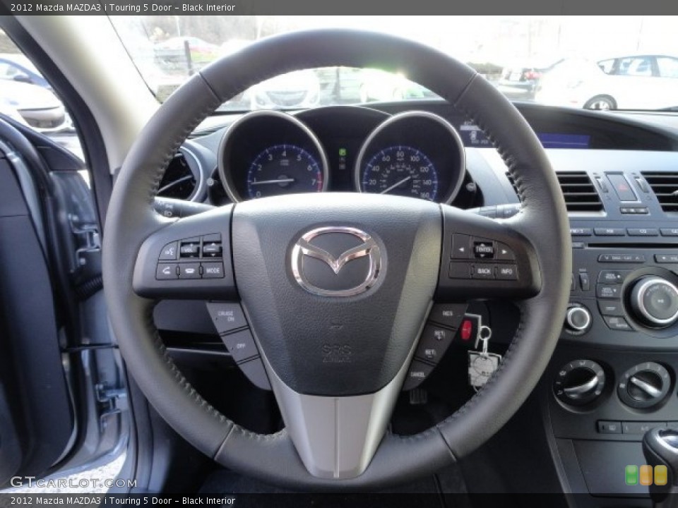 Black Interior Steering Wheel for the 2012 Mazda MAZDA3 i Touring 5 Door #57758819