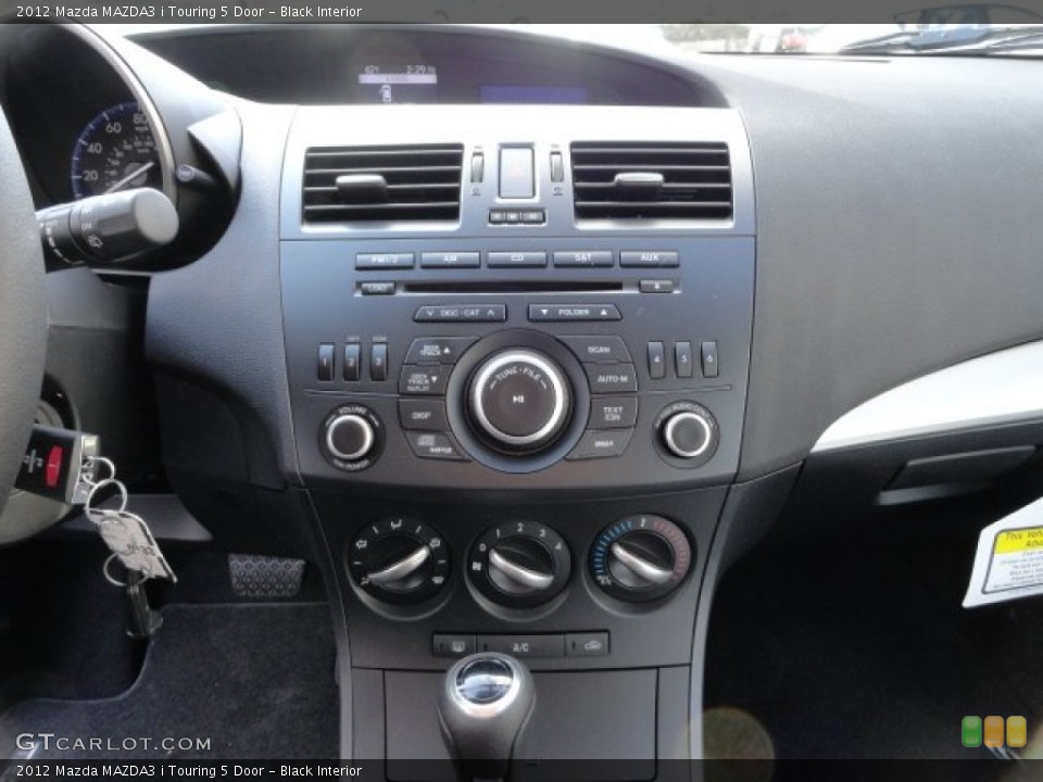 Black Interior Controls for the 2012 Mazda MAZDA3 i Touring 5 Door #57758828