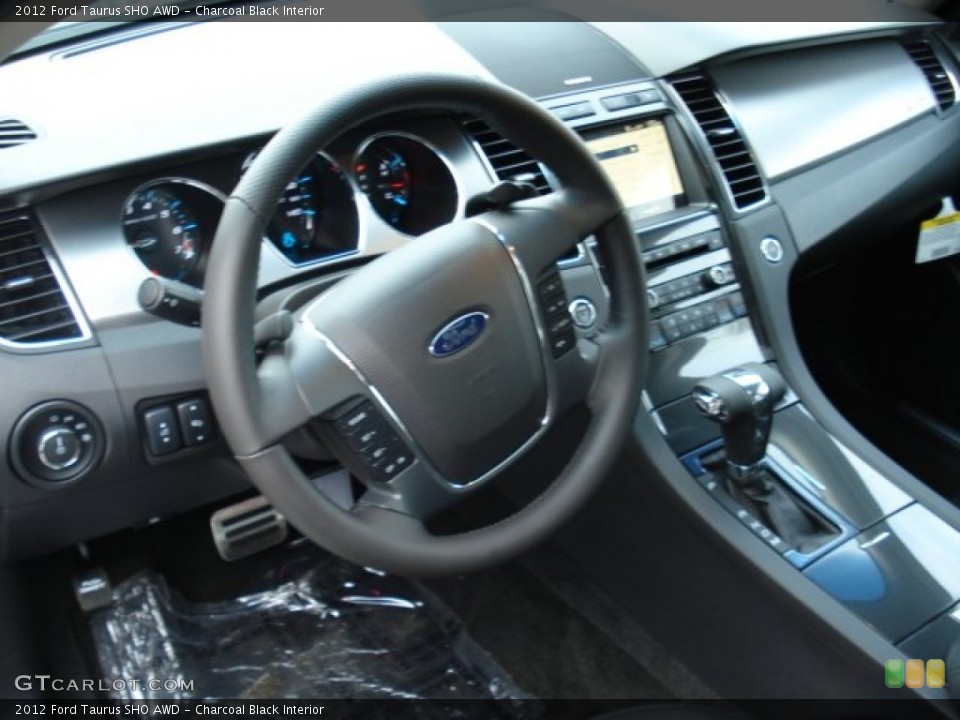 Charcoal Black Interior Steering Wheel for the 2012 Ford Taurus SHO AWD #57773787