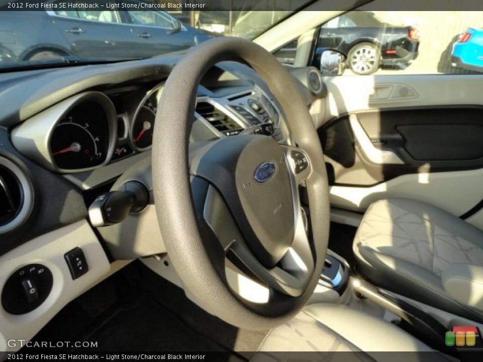 Light Stone/Charcoal Black Interior Steering Wheel for the 2012 Ford Fiesta SE Hatchback #57786576