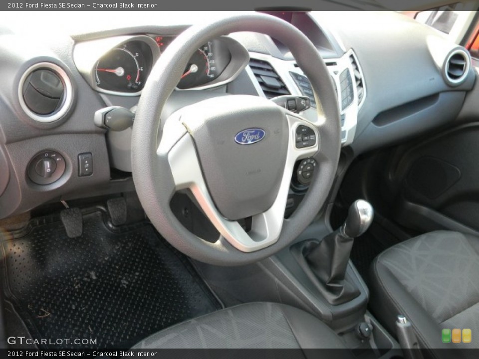 Charcoal Black Interior Dashboard for the 2012 Ford Fiesta SE Sedan #57883474
