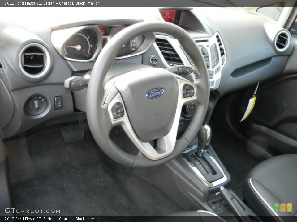 Charcoal Black Interior Dashboard for the 2012 Ford Fiesta SEL Sedan #57883627