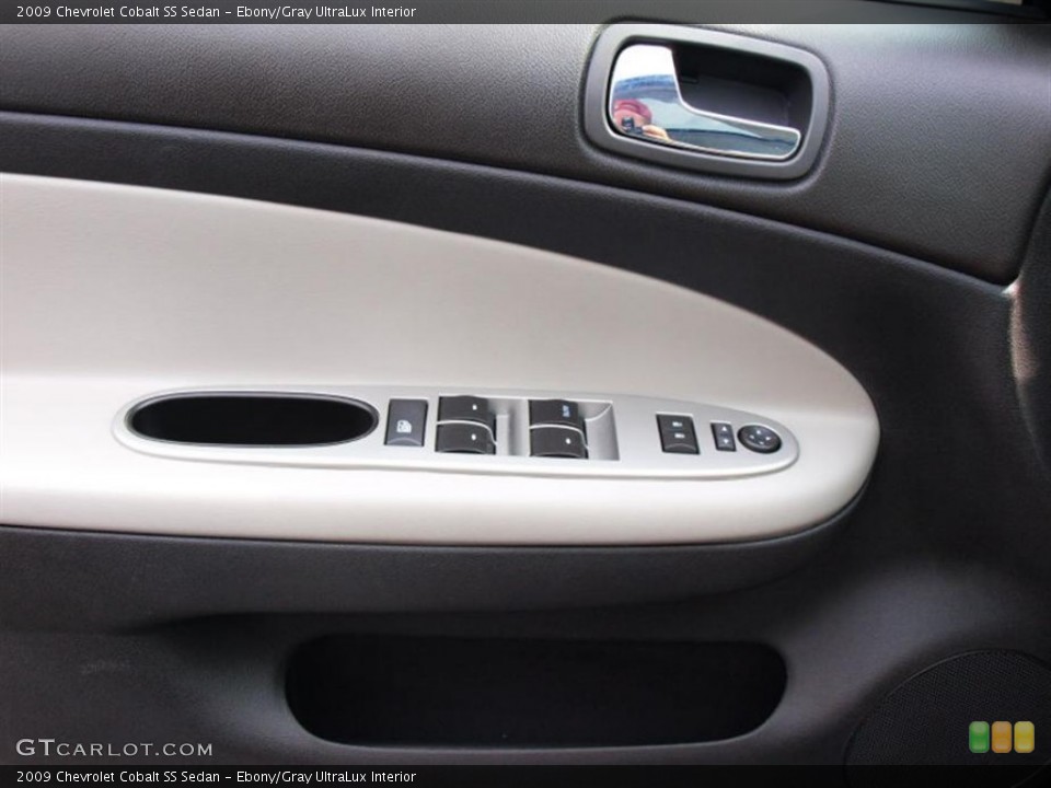 Ebony/Gray UltraLux Interior Door Panel for the 2009 Chevrolet Cobalt SS Sedan #58011119