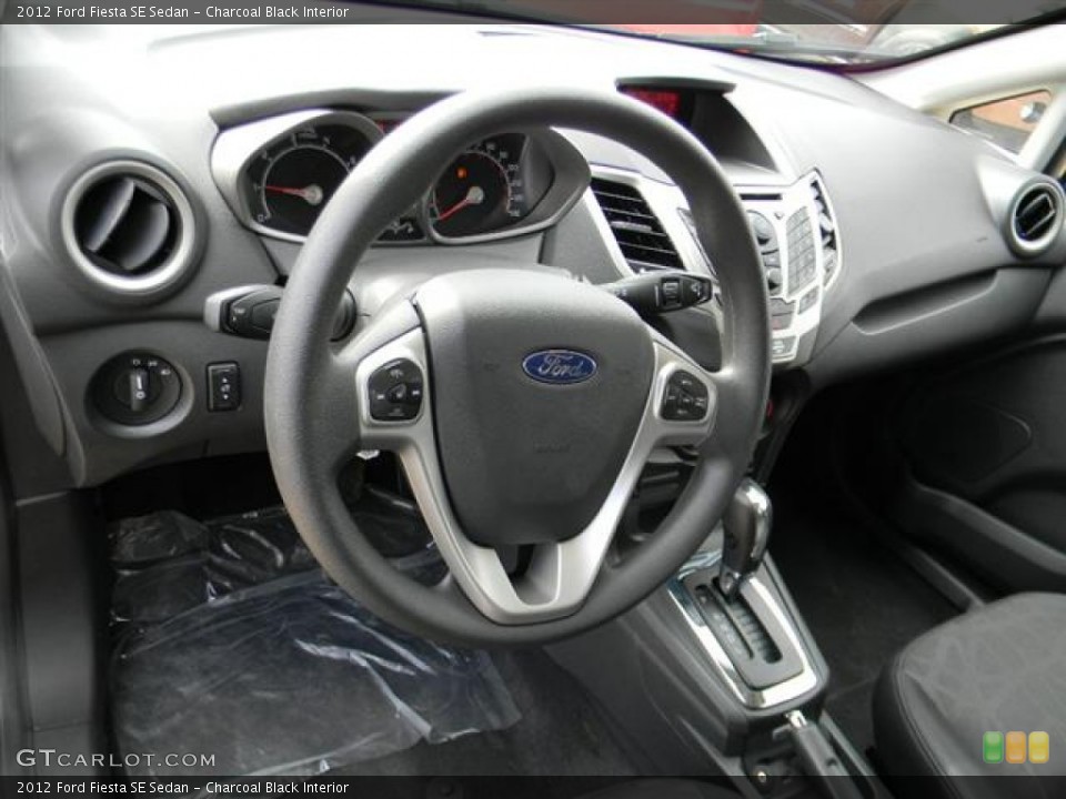 Charcoal Black Interior Dashboard for the 2012 Ford Fiesta SE Sedan #58143296