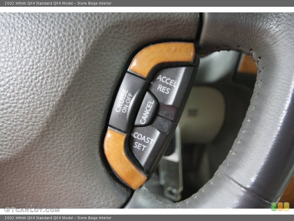 Stone Beige Interior Controls for the 2002 Infiniti QX4  #58504532