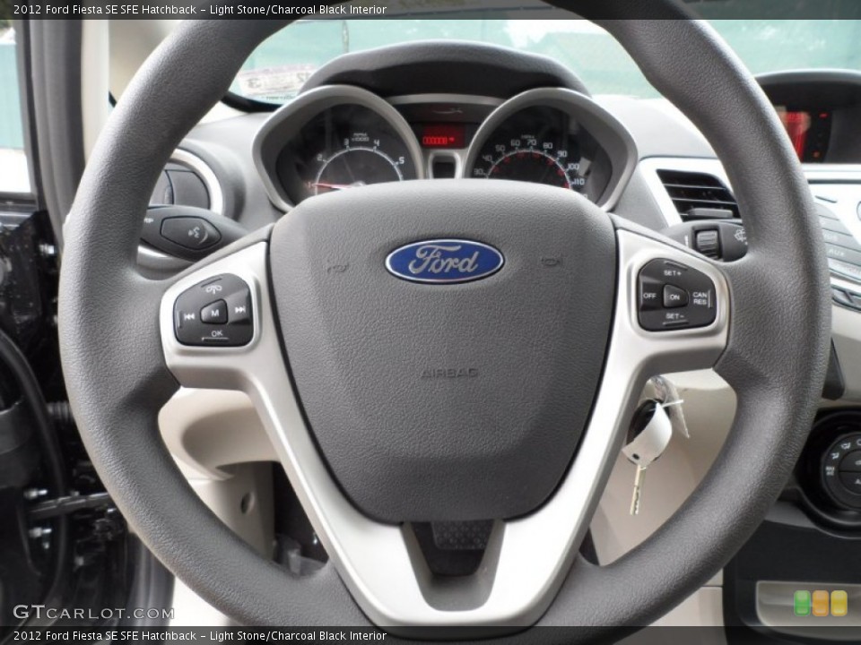 Light Stone/Charcoal Black Interior Steering Wheel for the 2012 Ford Fiesta SE SFE Hatchback #58658326
