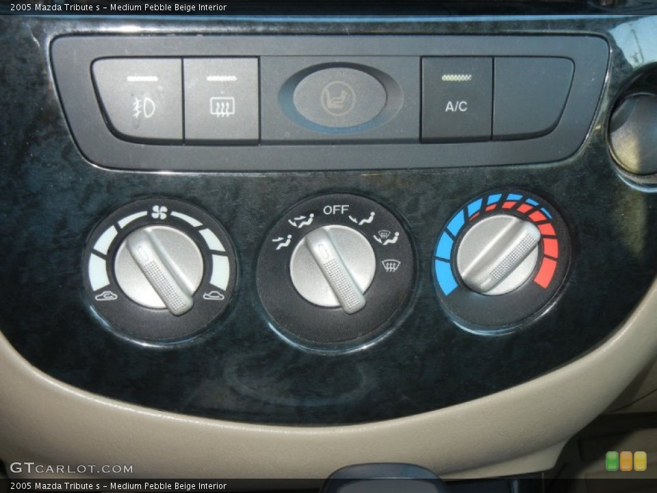 Medium Pebble Beige Interior Controls for the 2005 Mazda Tribute s #58863190