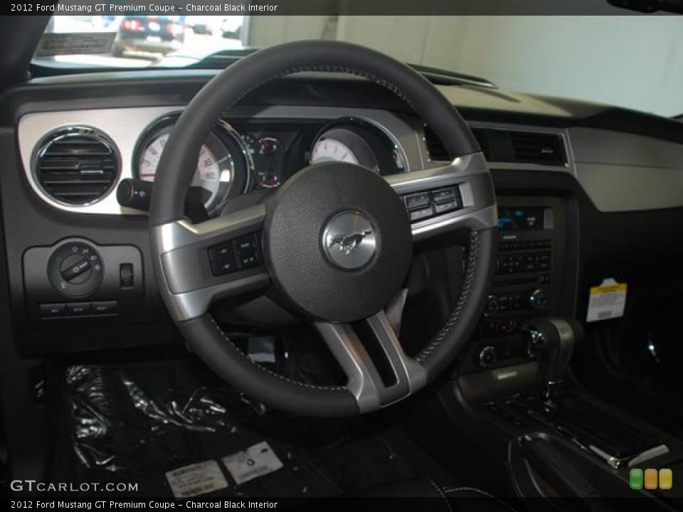 Charcoal Black Interior Steering Wheel for the 2012 Ford Mustang GT Premium Coupe #59021174