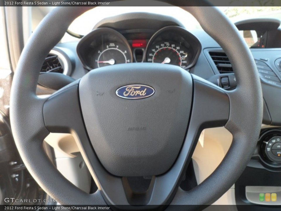 Light Stone/Charcoal Black Interior Steering Wheel for the 2012 Ford Fiesta S Sedan #59052173