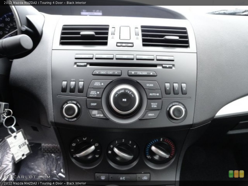 Black Interior Controls for the 2012 Mazda MAZDA3 i Touring 4 Door #59069698