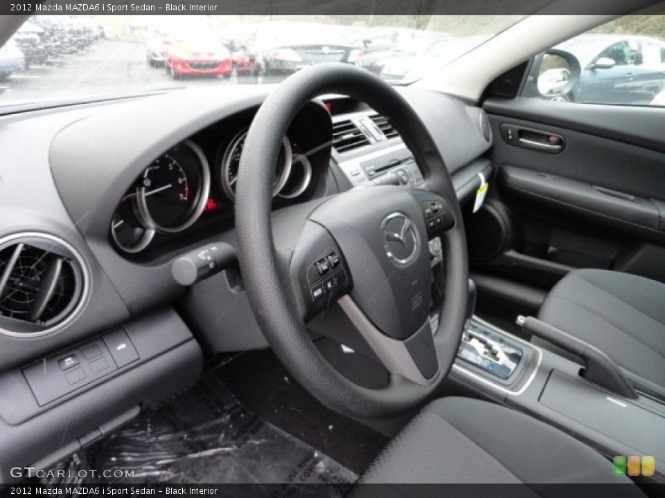 Black Interior Steering Wheel for the 2012 Mazda MAZDA6 i Sport Sedan #59070191