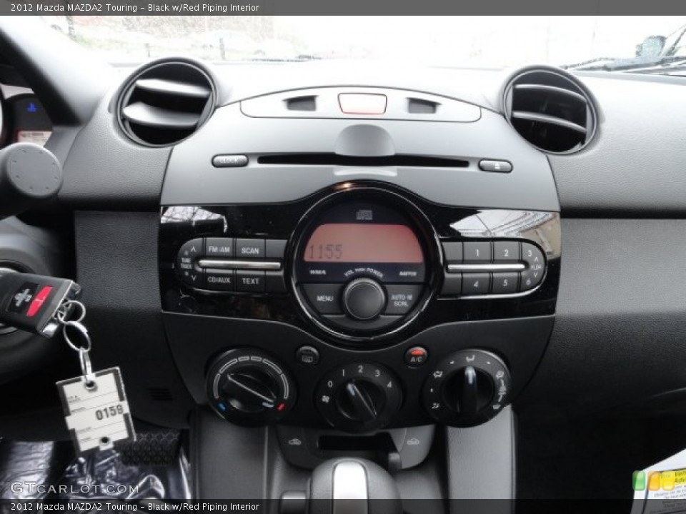 Black w/Red Piping Interior Controls for the 2012 Mazda MAZDA2 Touring #59070750