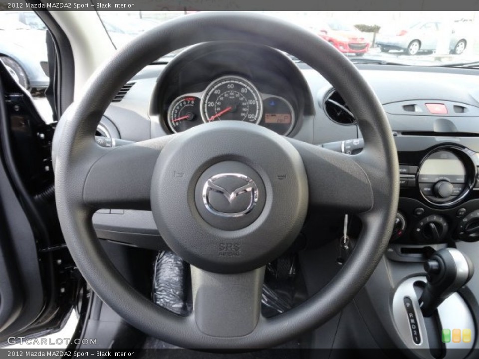 Black Interior Steering Wheel for the 2012 Mazda MAZDA2 Sport #59228168