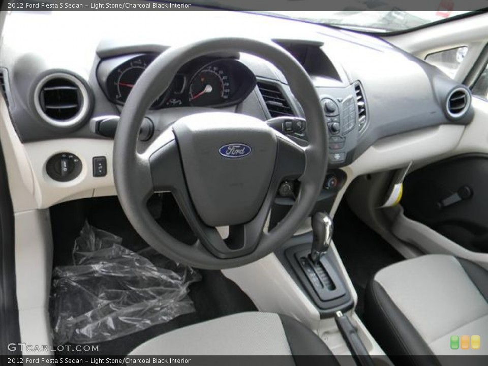 Light Stone/Charcoal Black Interior Dashboard for the 2012 Ford Fiesta S Sedan #59232258