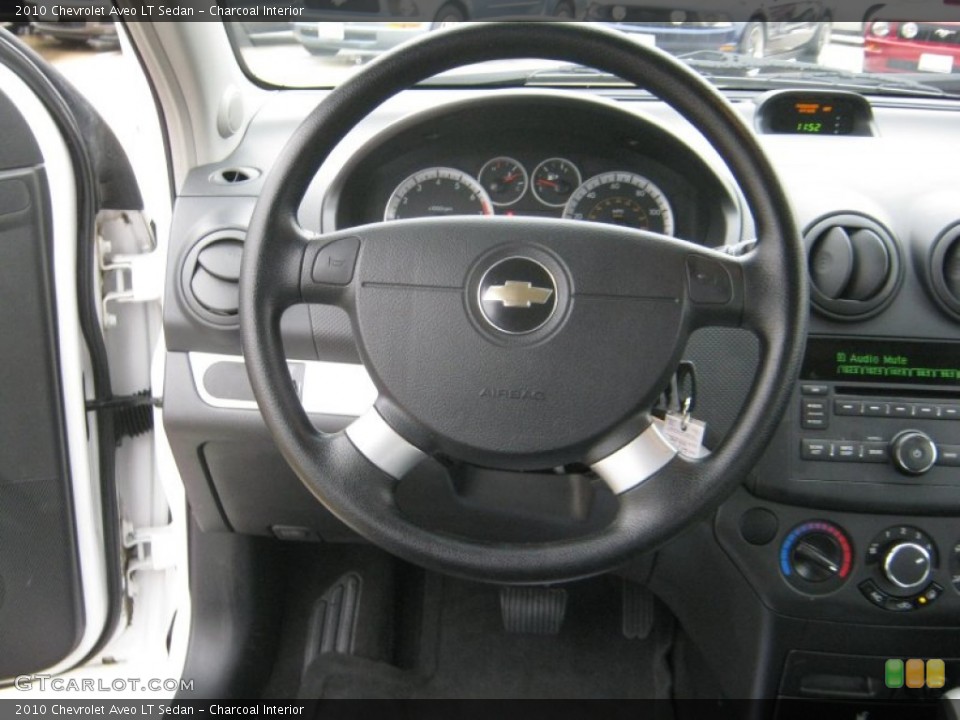 Charcoal Interior Steering Wheel for the 2010 Chevrolet Aveo LT Sedan #59388628