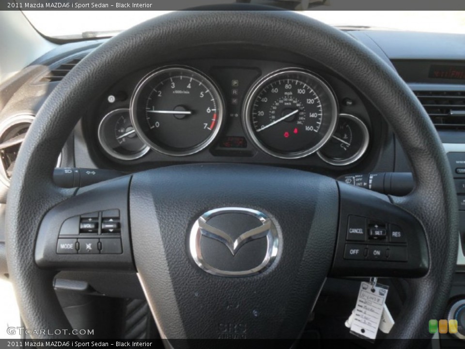Black Interior Steering Wheel for the 2011 Mazda MAZDA6 i Sport Sedan #59622561