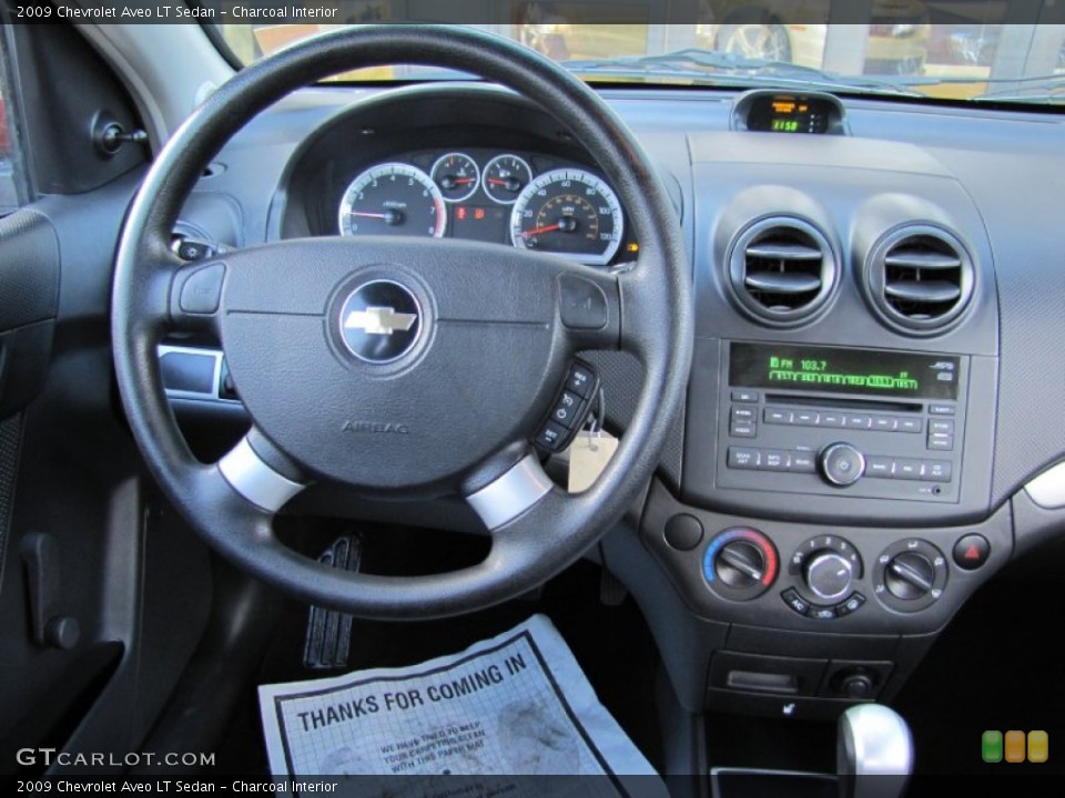 Charcoal Interior Dashboard for the 2009 Chevrolet Aveo LT Sedan #59636940