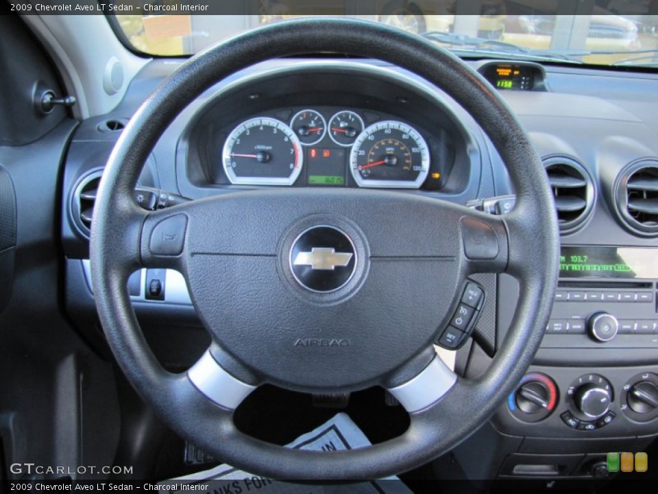 Charcoal Interior Steering Wheel for the 2009 Chevrolet Aveo LT Sedan #59636952