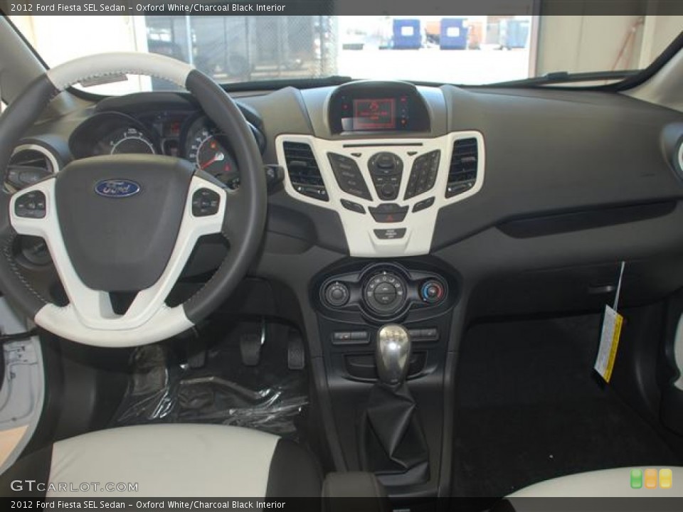 Oxford White/Charcoal Black Interior Dashboard for the 2012 Ford Fiesta SEL Sedan #59685302