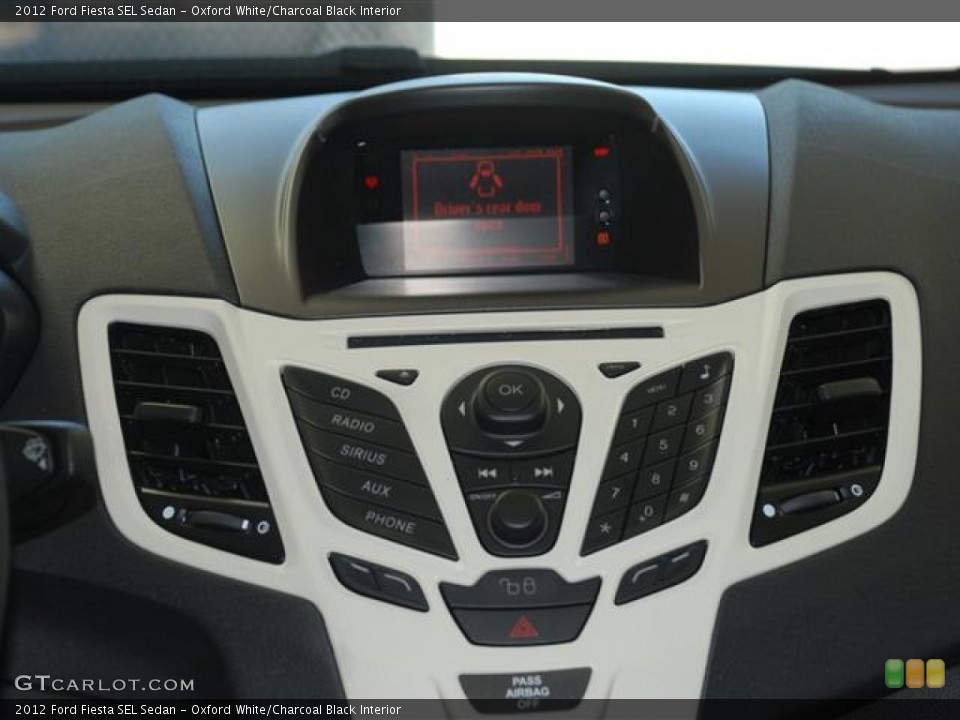 Oxford White/Charcoal Black Interior Controls for the 2012 Ford Fiesta SEL Sedan #59685308