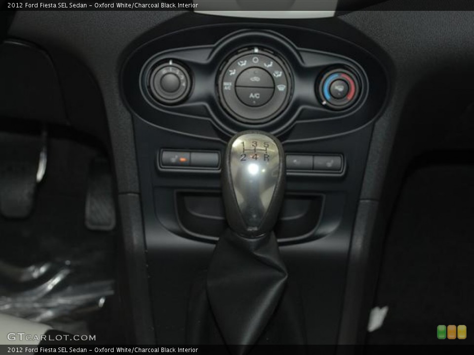 Oxford White/Charcoal Black Interior Controls for the 2012 Ford Fiesta SEL Sedan #59685314